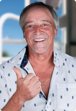 Middle age man smiling after having his dental implants in Los Algodones, Mexico