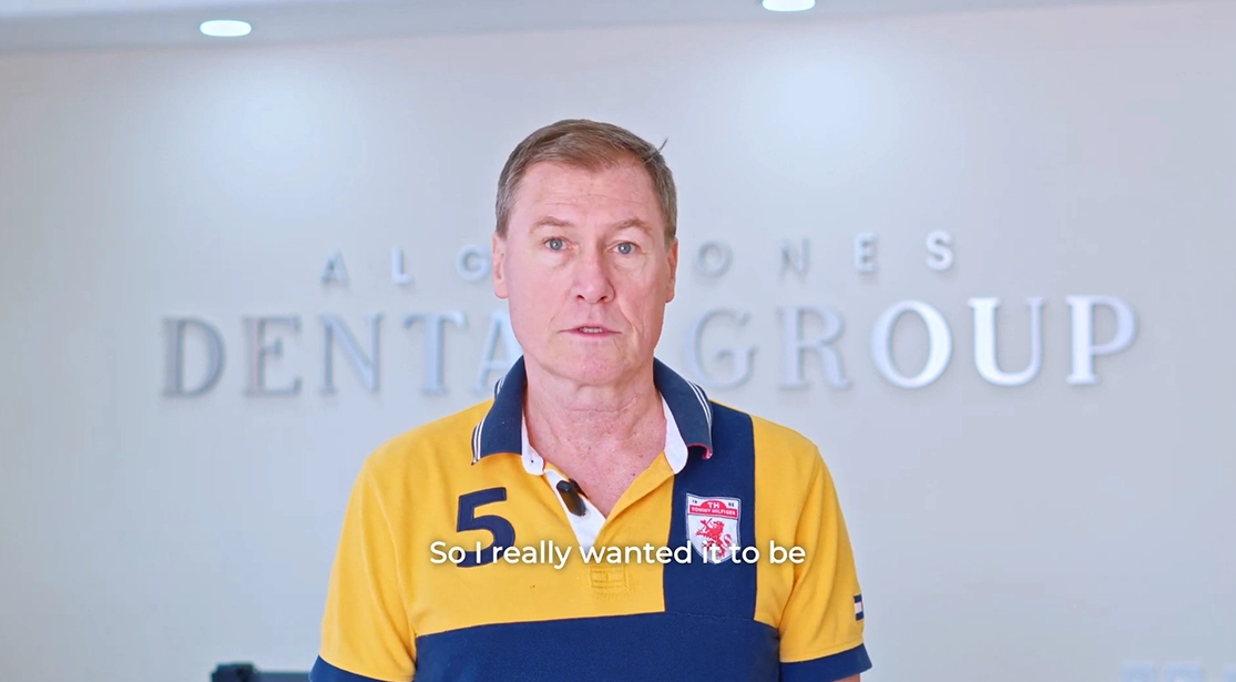 senior smiling for his dental work in cancun